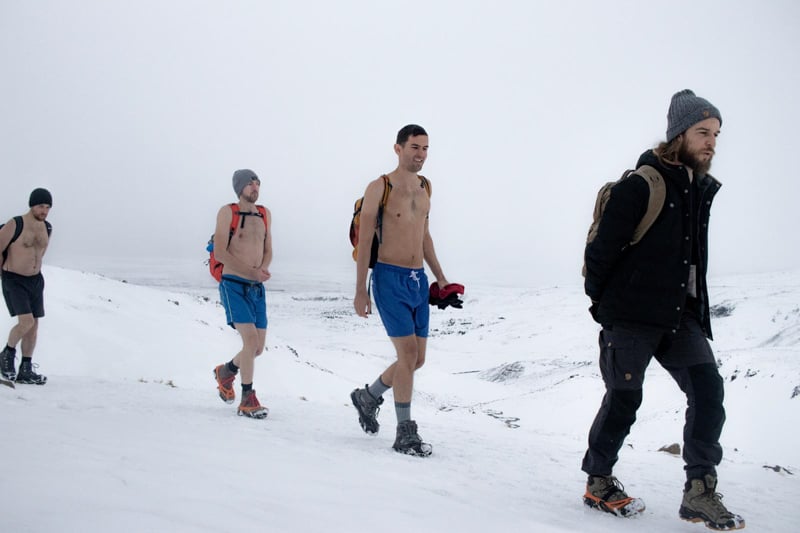 Hiking a mountain in Iceland while wearing a bathing suit.