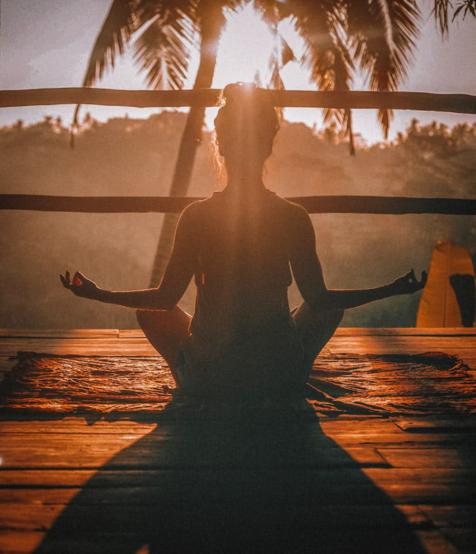 Meditating at a tropical wellness resort