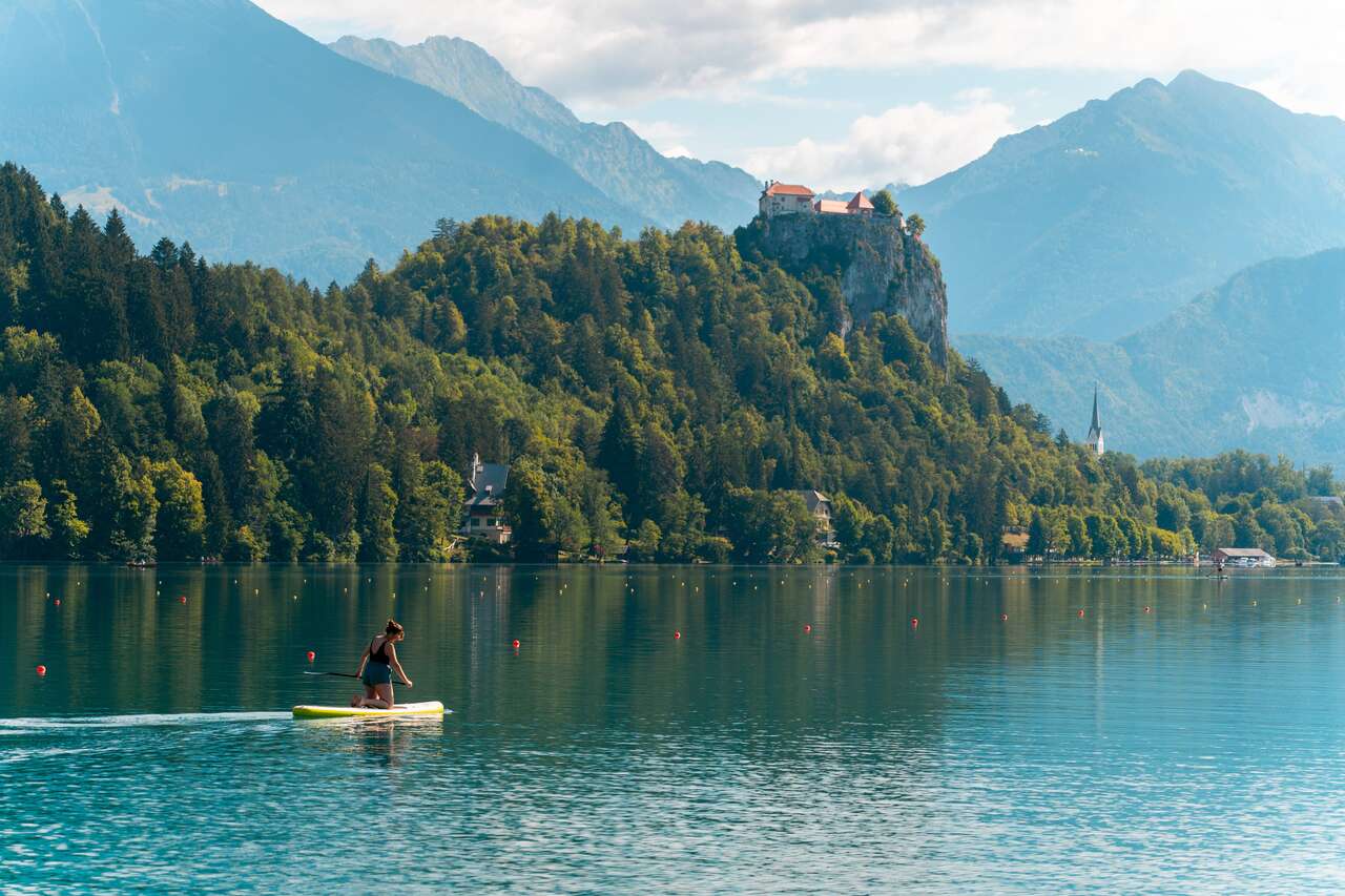 A person on a paddle board at Lake Bled
