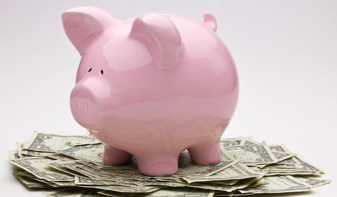 saving money for travel in your piggy bank